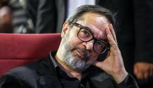 ماجرای عکس حاج قاسم روی دیوار اتاق کارن همایونفر
